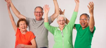 Image of Senior Citizens with hands up.